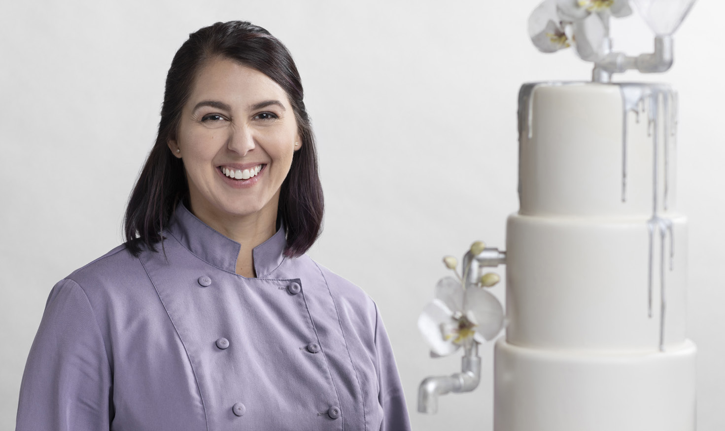 Woman with a white designed cake